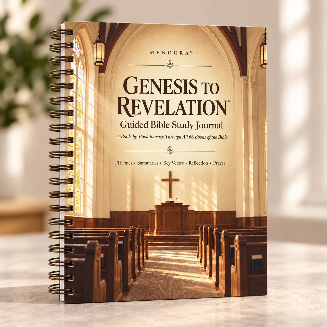 The spiral-bound Genesis to Revelation guided Bible study journal standing on a table in soft window light